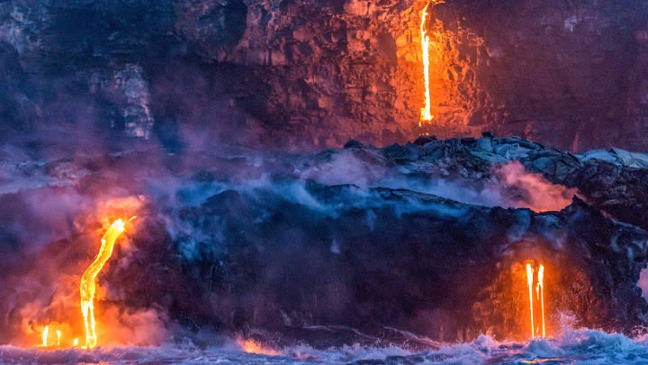 Molten lava falling into the ocean (image uploaded to Reddit by u/9999monkeys).