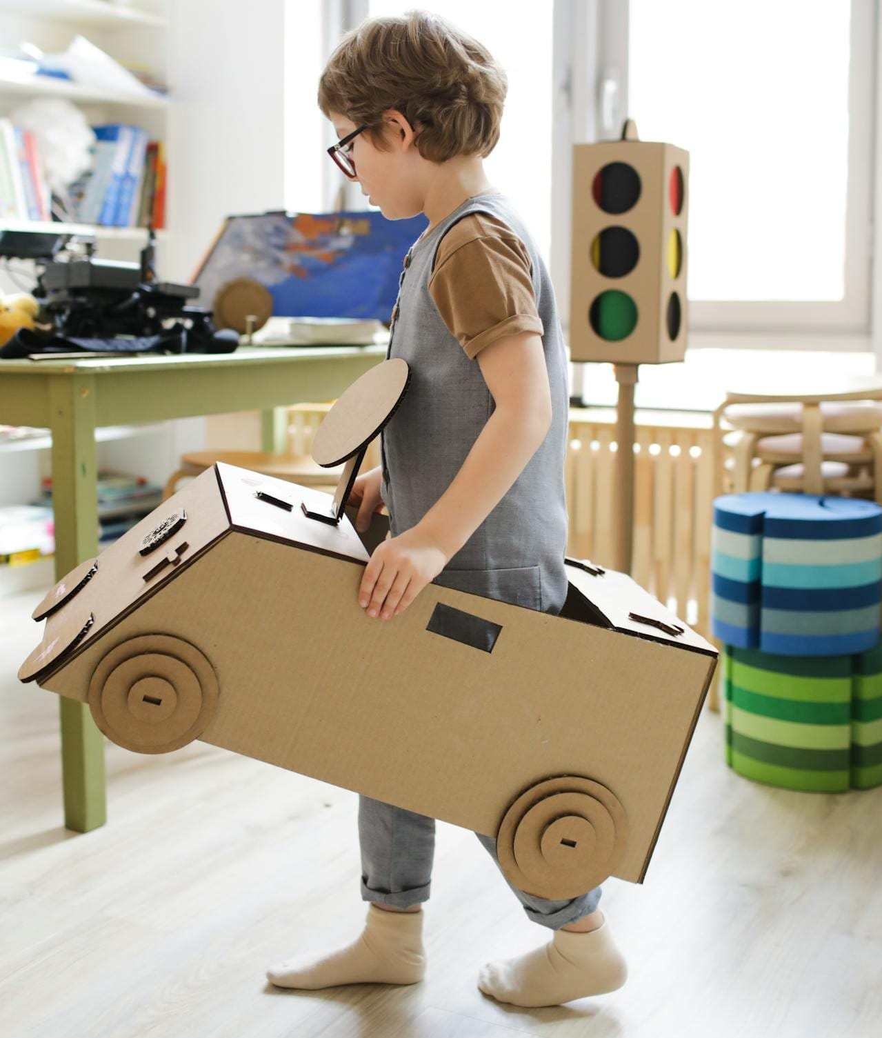 boy playing with wooden toys