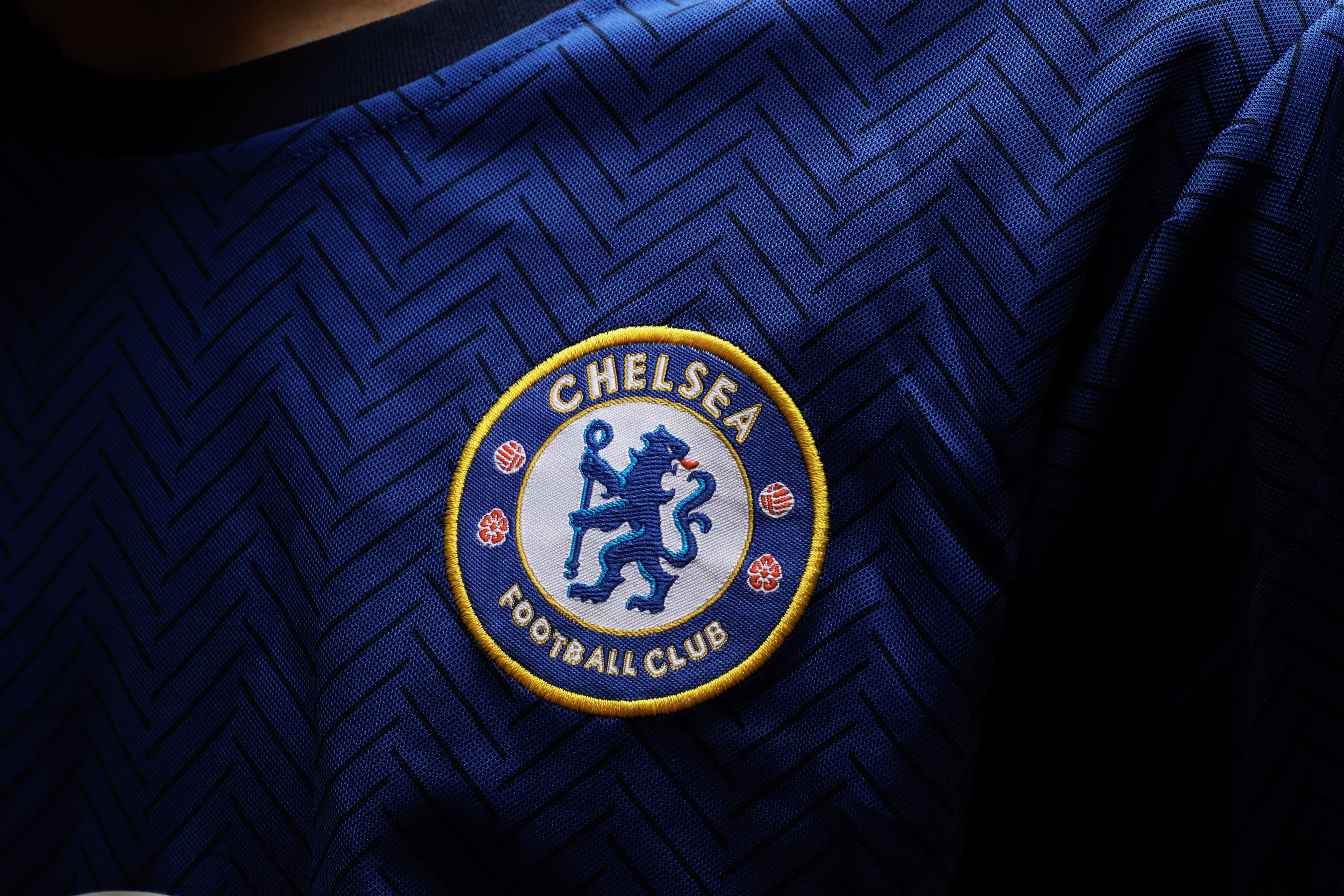 Chelsea FC football shirt and badge close-up