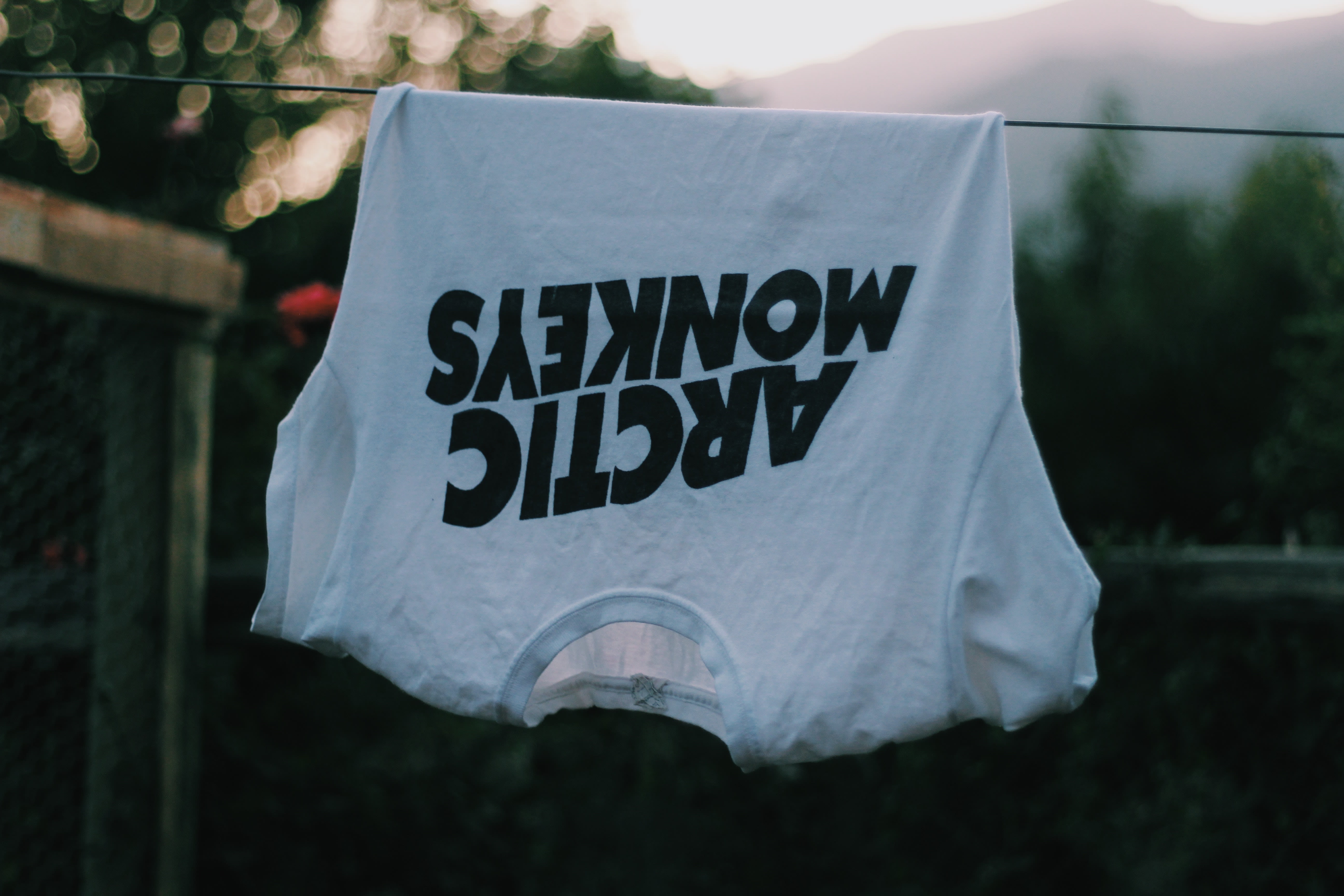 An Arctic Monkeys shirt hanging up.