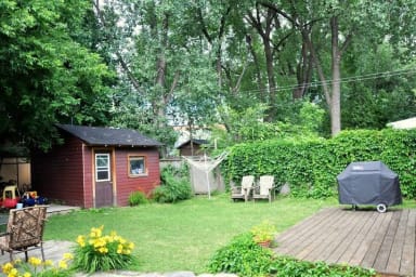 Huge backyard with table and chairs... and a BBQ!