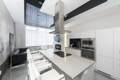 Fully equipped kitchen, island with cooking top.