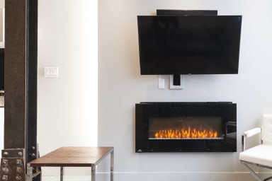 Electronic fireplace and smart TV with cable in the living room