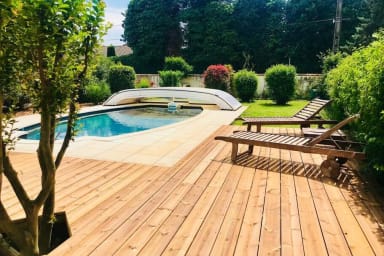 Outdoor swimming pool with wooden deck 