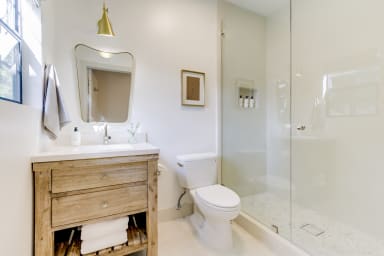 A private bath with a rain shower