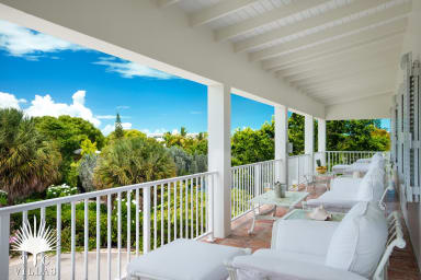 Reef Pearl's balcony with ample seating a beach views.