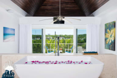 Little Plum's soaking tub with views of the Turtle Cove Marina.