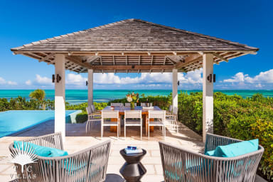 Covered gazebo with outdoor dining table at Castaway.