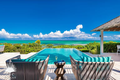 Relax, unplug, and enjoy the breeze lounging around Castaway's pool.