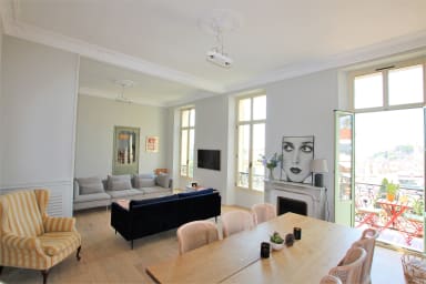 Large living room, lounge area, TV, dining area and sea view