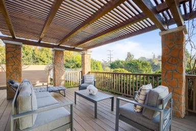 Front porch with outdoor seating and views!