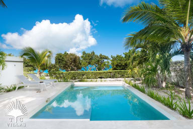 Heated pool steps from Grace Bay Beach.