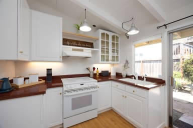 Modern kitchenette with sink, fully equipped for convenient cooking