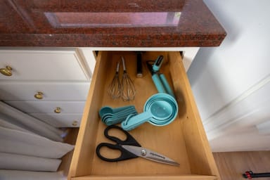 Practical kitchen with all essential cooking tools and utensils