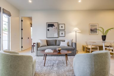 Convertible sofa bed that can sleep up to 2 guests.