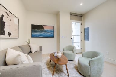 Seating area with sofa and lounge chairs