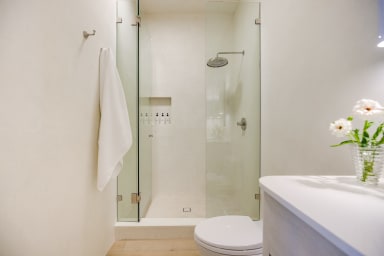En-suite bathroom with rain shower and high-end toiletries