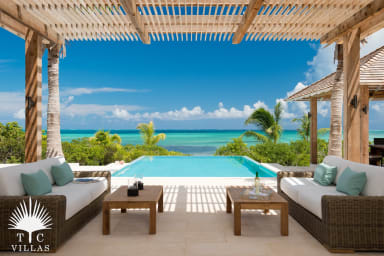 Outdoor lounging area with private pool (14x30) and beach access.