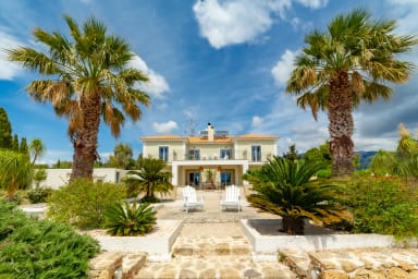 Front facade of property with beautiful landscaping