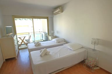 first bedroom with 2 singles beds, open on small terrace