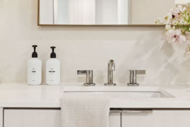 En-suite bathroom with rain shower and high-end toiletries