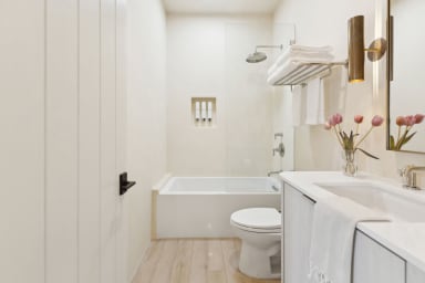 En-suite bathroom with rain shower and high-end toiletries