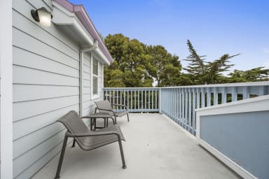 Private balcony with two chairs and serene views