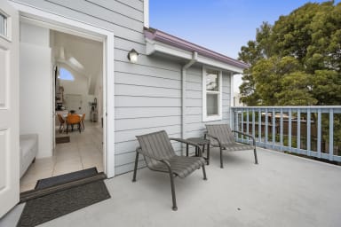 Private balcony with two chairs and serene views
