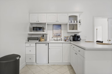 Fully equipped kitchen with modern appliances and sleek design