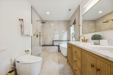 Fully renovated master bathroom with open shower and soaker tub!