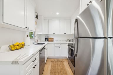 Full kitchen: Coffee drip, fridge, stove/oven, plates and utensils, dishwasher