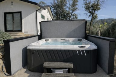 AI generated image of the hot tub as we await new landscaping and photography