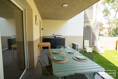 Shaded terrace with garden furniture, electric plancha grill... 