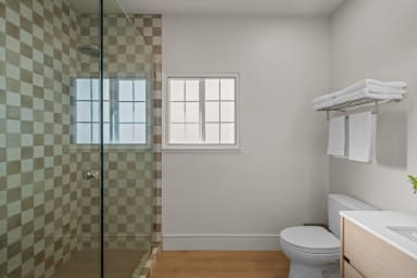 En-suite bathroom with rain shower and high-end toiletries