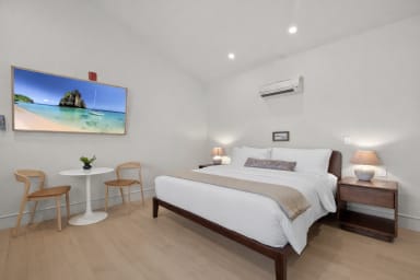 King-size bed, sleeps 2, seating area, and 65