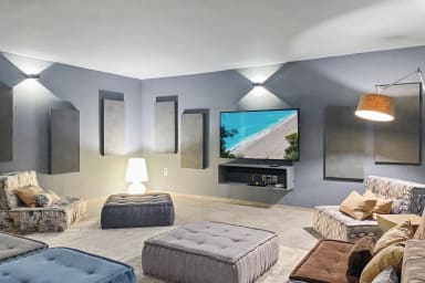 Lounge in the chic, cozy living room with entertainment and plush seating.