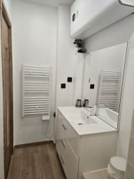 Towel dryer, vanity unit, mirror