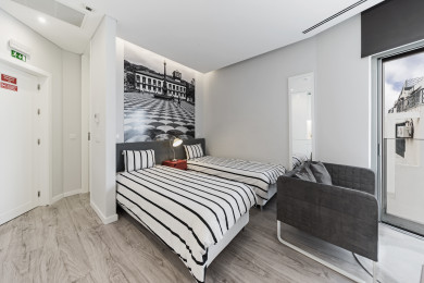 Bedroom with two single beds and living room