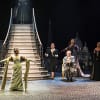 Left of stairs: Clare Burt as Ada Harris Right of stairs: Joanna Riding as Madame Cobert and Mark Meadows as the Marquis with the company at the House of Dior