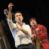 Ben Turner (Amir, centre) and Farshid Rokey (Hassan, right) in the 2013 production of The Kite Runner at Nottingham Playhouse
