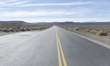 a close up of a desert road