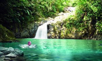 a large waterfall over a body of water