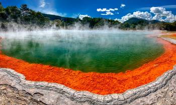 a body of water with a mountain in the background