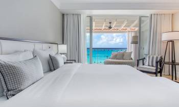 a bedroom with a large bed in a hotel room