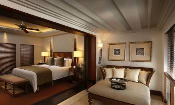 a bedroom with a large bed in a hotel room