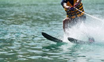a person riding a surf board on a body of water