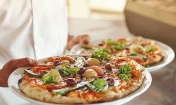a pizza sitting on top of a table
