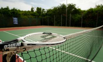 a player holding a racket on a court