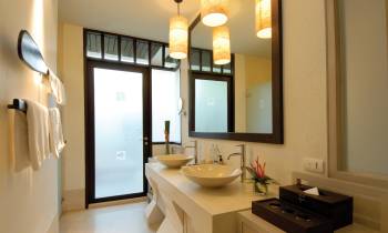 a room with a sink and a mirror