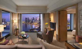 a living room filled with furniture and a flat screen tv